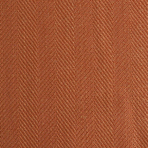 Close up of a rust fabric swatch